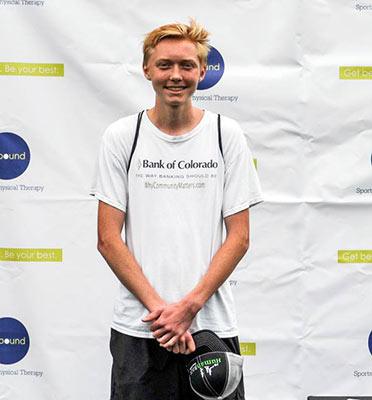 Carter Campbell is awarded second place overall at the Fort Collins Human Race